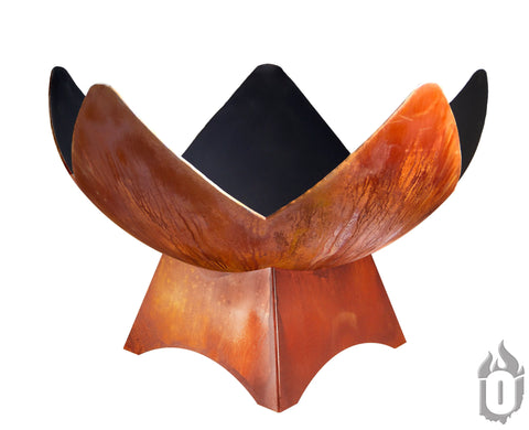 The “Fire Flower” Fire Bowl by Ohio Flame is a modern, rust-colored metal artisan fire bowl featuring four curved panels and an angular base. Made in the USA, it showcases Ohio Flame’s signature craftsmanship with a flame logo on the base.