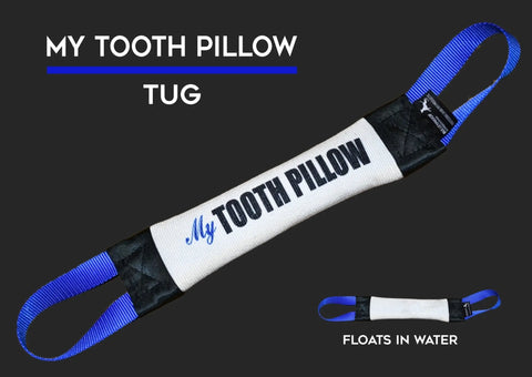 The Tooth Pillow Fire Hose Training Tug by Bulletproof Pet Products Inc is a white and black rectangular toy with blue handles, made in the USA. Shown floating in water, its ideal for firefighting training accessories.