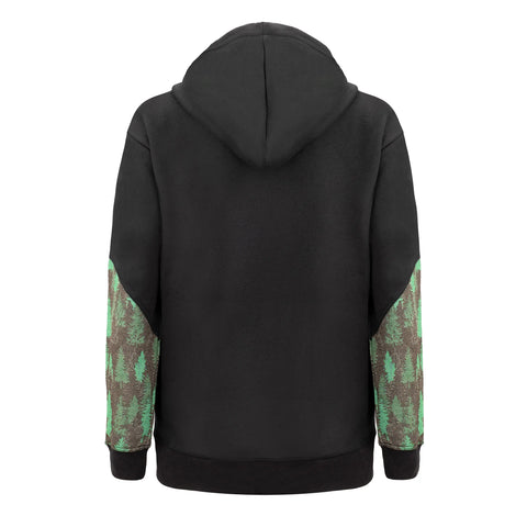 The Fireside Pine Black Cottonwood- Forest Green hoodie, made in the USA, features green and brown tree-patterned sleeves, a plain black body, and is shown from the back with the hood up for a warm, cozy look.