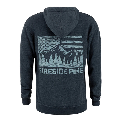 The Ponderosa Pine - Total Eclipse by Fireside Pine is a dark gray French Terry Fleece hoodie featuring a light blue back graphic with mountains, pine trees, an American Flag Mountain design, and the words FIRESIDE PINE.