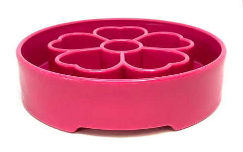 The SodaPup Flower Design EBowl Enrichment Slow Feeder Bowl for Dogs is a bright pink, round plastic bowl with an internal raised flower pattern to slow down eating and enrich mealtime, plus a smooth outer surface.