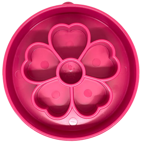 The Flower Design EBowl Enrichment Slow Feeder Bowl for Dogs by SodaPup features a pink circular silicone mold with five heart-shaped sections forming a flower pattern, perfect for providing enrichment at mealtime.
