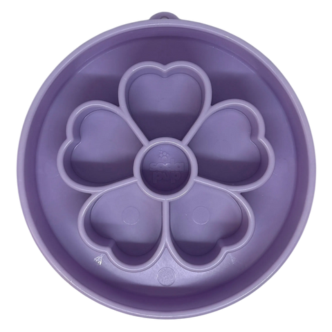 The SodaPup Flower Design EBowl Enrichment Slow Feeder Bowl for Dogs is a round, purple silicone bowl with five heart-shaped compartments in a flower pattern, perfect for enrichment and shown from above.