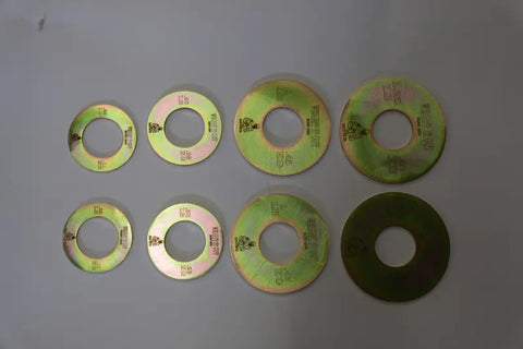 Eight shiny, greenish-tinted Fractional Solid Steel Mini Olympic Weight Plates from Weight It Out are arranged in two rows. Each features engraved text and numbers, designed for precise weight increases on an Olympic bar.