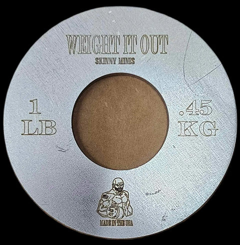 The Weight It Out Fractional Solid Steel Mini Olympic Weight Plate is a round silver plate labeled 1 LB / .45 KG, features a muscular figure and MADE IN YER USA, ideal for gradually increasing Olympic bar weight.