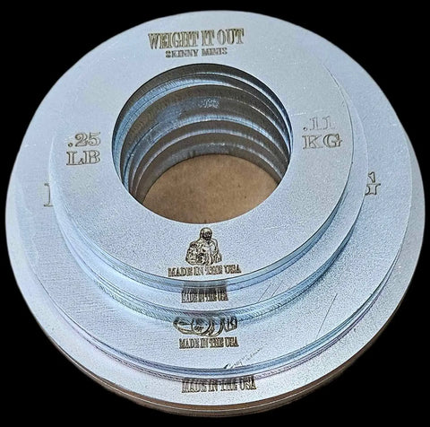 A stack of Weight It Out Fractional Solid Steel Mini Olympic Weight Plates, each labeled .25 LB / .11 KG with an engraved logo and MADE IN THE USA—ideal for gradual weight increases on any Olympic bar.