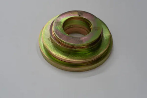 A metallic gold and green-tinted Fractional Solid Steel Mini Olympic Weight Plate by Weight It Out, featuring concentric circular layers, is displayed on a plain white background.