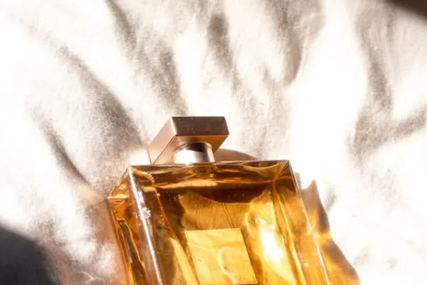 Gold perfume bottle with a blurred background