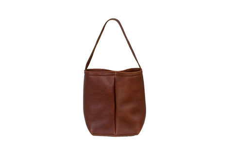 The Urban Southern Urban Dual Wine Tote is a brown full-grain leather carrier with a single handle and simple design, free of visible logos or decorations, shown against a plain white background.