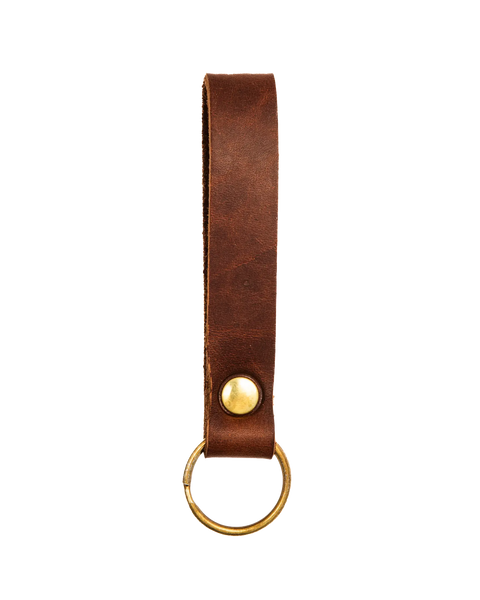 The Homestead Brand Standard Key Fob No. 1603 is a simple brown USA-tanned leather keychain loop with solid brass snap button and key ring, photographed on a white background.
