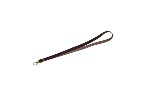 The Urban Southern Leather Lanyard is a brown full-grain leather wrist strap with a metal clasp, American-made and shown on a white background.