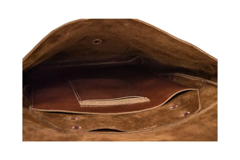 The image displays the Urban Southern Urban Rucksack’s spacious interior, featuring a large main compartment and a smaller inner pocket, both lined with soft material.