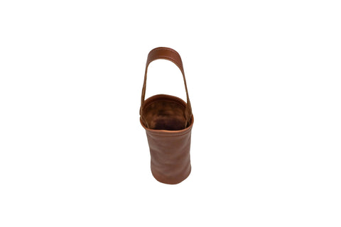 The Urban Southern Urban Wine Tote is a brown leather wine carrier with a sturdy handle, shown from above on a white background. The tote is empty, featuring a soft and flexible structure.
