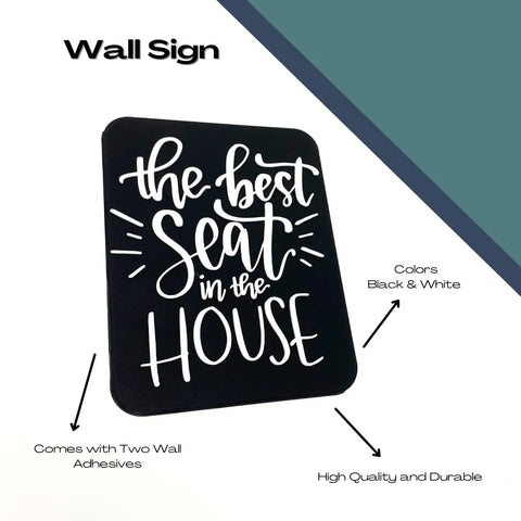 The Best Seat in the House Decorative Bathroom Sign by Chatelet Manufacturing features a black rectangular design with white text, is high quality and durable, comes with two wall adhesives, and is made in the USA. Perfect for adding humor to any bathroom.