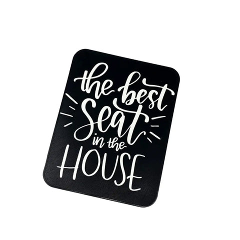 The Chatelet Manufacturing The Best Seat in the House Decorative Bathroom Sign features playful white script on a black rectangular background—funny wall art perfect for quirky bathroom decor.