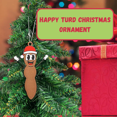 A Christmas tree features a Chatelet Manufacturing Funny Gag Gift Christmas Ornament next to a large red gift box. A sign reads the product name—perfect as a hilarious Dirty Santa or holiday ornament, made in the USA!.