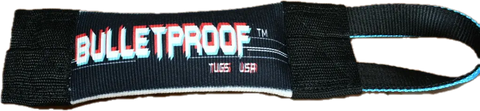 A black fabric loop tag with BULLETPROOF in bold white and red letters, USS USA beneath, stitched edges, and a webbing loop—perfect for your Fur Missile Fire Hose Pocket Tug by Bulletproof Pet Products Inc.