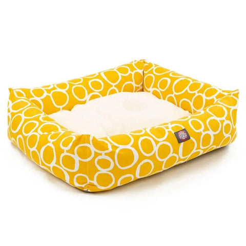 The Majestic Pet Fusion Luxe Bagel Bed is a rectangular yellow dog bed with white circles, raised sides, and a soft cream cushion. Machine washable for easy cleaning, it offers lasting comfort for your pet.