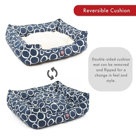 The Majestic Pet Fusion Contemporary Lounge Bed is a rectangular dog bed with a navy and white circle pattern. It has a reversible, double-sided removable cushion (patterned or white), plus durable, machine-washable upholstery.