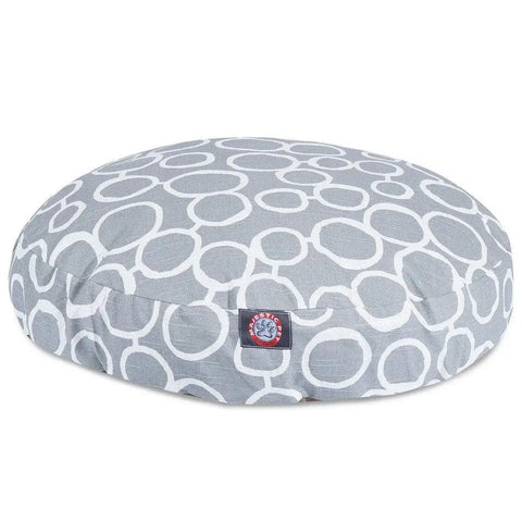 The Majestic Pet Fusion Round Dog Bed is gray with a white circular pattern, features a small blue and red logo tag, and has a soft removable washable cover—perfect for dogs or cats and easy to keep clean.