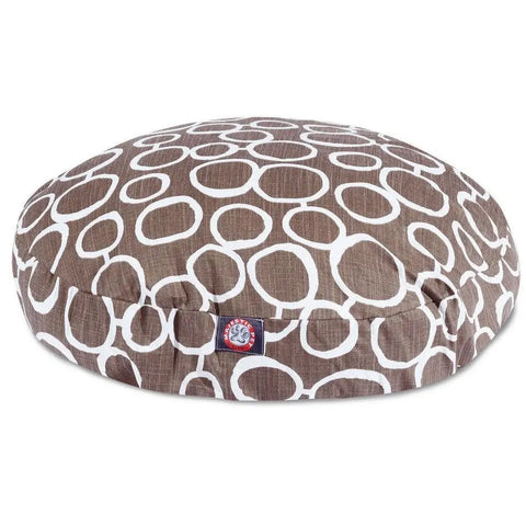 The Majestic Pet Fusion Round Dog Bed is brown with white, irregular circles and a blue and red logo tag. It has a washable, removable cover and is shown against a white background.