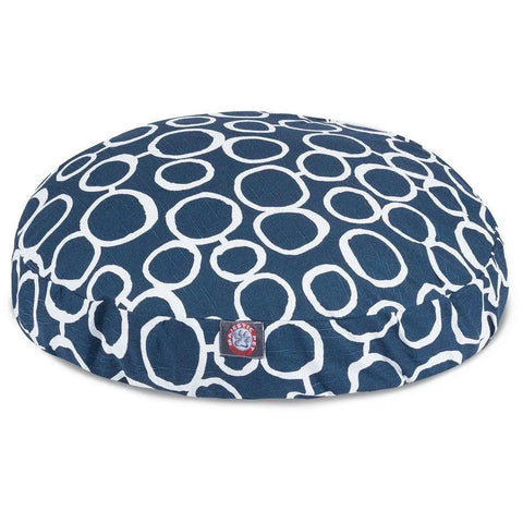 The Majestic Pet Fusion Round Dog Bed features a navy blue design with large white circles, a removable cover for easy washing, and a side fabric tag—combining style and comfort for your dog.