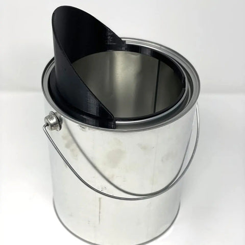 The Chatelet Manufacturing Gallon Paint Pourer fits gallon-sized paint cans, features a black plastic insert dividing the interior, and has an improved pour spout to prevent spills. Shown here on a plain white surface.