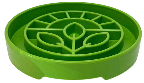 The SodaPup Garden Design ETray Enrichment Shallow Slow Feeder Dog Bowl is a round, green tray with raised dividers shaped like three leaves, designed to slow eating and enrich dogs' mealtimes.