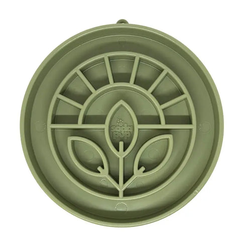 The SodaPup Garden Design ETray is a round, green silicone slow feeder dog bowl with a leaf and sunburst pattern, ideal for enrichment or sealing containers.