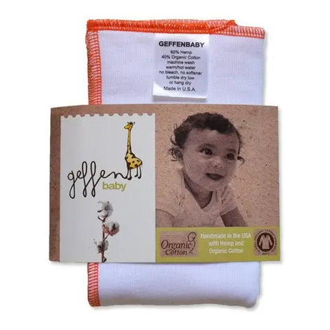 The Geffenbaby Jersey Cloth Diaper Prefold, made from 60% hemp and 40% organic cotton, features orange trim, a giraffe illustration, and “Geffenbaby” label. Handmade in the USA, it’s ideal for reusable diapering.