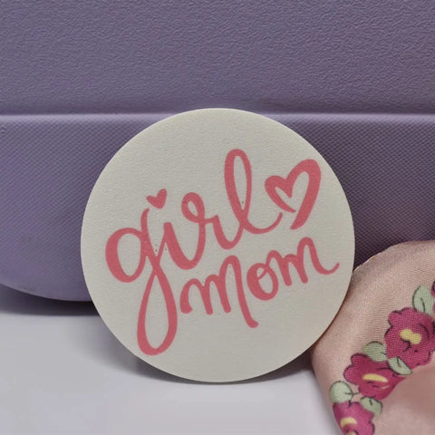 The Chatelet Manufacturing FRESHe BOGLETS Girl Mom Charm is a pink and white decorative accessory for Bogg Bags, featuring girl mom in pink cursive with a heart—perfect for personalizing your bag.