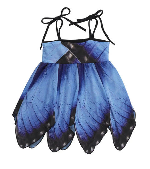 The Kids Blue Morpho Butterfly Dress by Spiritex | Sustainable Apparel is a sleeveless childrens dress with shoulder tie straps, a handkerchief hemline, and a blue butterfly wing design with black edges and delicate vein patterns.