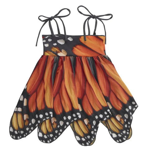 The Kids Monarch Dress by Spiritex | Sustainable Apparel features spaghetti straps, a playful handkerchief hemline, and a vibrant print inspired by orange, black, and white monarch butterfly wings.