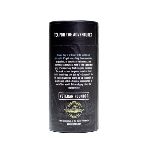 A black cylindrical tea canister labeled Glacier Bay Grey from My Store captures an adventurous spirit with its bold Earl Grey Tropical Black Tea blend. The Sasquatch Tea Company logo is displayed at the bottom, honoring its veteran-founded roots.