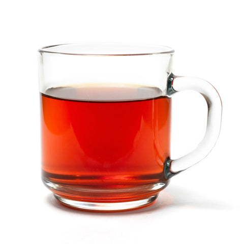 A clear glass mug filled with Glacier Bay Grey (Earl Grey Tropical Black Tea) by My Store, photographed against a white background.