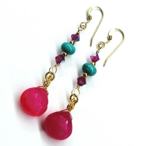 Alexa Martha Designs Gold Filled Wire Wrapped Pink and Turquoise Gemstone Earrings feature gold hooks with hot pink chalcedony teardrops, turquoise rounds, and small purple faceted beads in a vertical design.