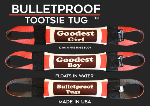 The Goodest Boy Fire Hose Training Tug - Candy Series by Bulletproof Pet Products Inc is a 12-inch, red and black, heavy-duty dog toy made in the USA from durable fire hose material—it floats and is perfect for tough play.