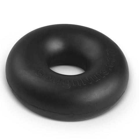 A black, donut-shaped rubber chew toy from Goughnuts’ Medium Rings line (for dogs 30-70 lbs) is shown on a white background, featuring the brand name embossed and backed by the trusted Goughnuts Guarantee.