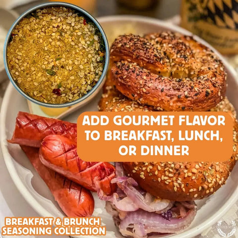 A plate with sliced sausage, grilled onions, and two seeded bagels sits next to a bowl of Gustus Vitae Gourmet Breakfast Seasoning Set 6-Pack – Natural Flavors. Text overlay: Elevate breakfast, lunch, or dinner with gourmet flavors. Made in USA.