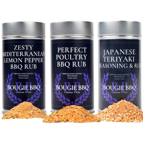 The Gustus Vitae Deluxe Chicken BBQ Seasonings Collection - 3 Pack features Zesty Mediterranean Lemon Pepper, Perfect Poultry, and Japanese Teriyaki spices—ideal for chicken BBQ—with each blend displayed in metal tins alongside small sample piles.