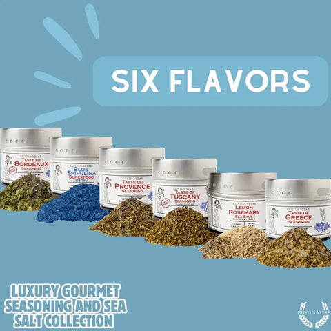 Six tins of Gustus Vitae Gourmet Seasoning and Sea Salt Gift Set – 6 Tin Collection, handcrafted in the USA, are arranged with colorful seasoning piles—including Blue Spirulina—each tin labeled with a distinct flavor.