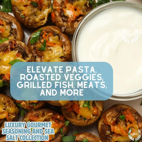 Stuffed mushrooms with cheese and herbs surround a sauce, with overlaid text: Elevate pasta, veggies, meats & more with the Gourmet Seasoning and Sea Salt Gift Set – 6 Tin Collection by Gustus Vitae, handcrafted in the USA.