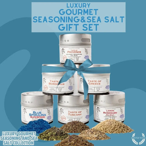 Six tins from the Gustus Vitae Gourmet Seasoning and Sea Salt Gift Set – 6 Tin Collection are arranged pyramid-style with a blue bow. Bold spices, like Blue Spirulina Sea Salt, are in front. Text: “Luxury Gourmet Seasoning & Sea Salt Gift Set.”.