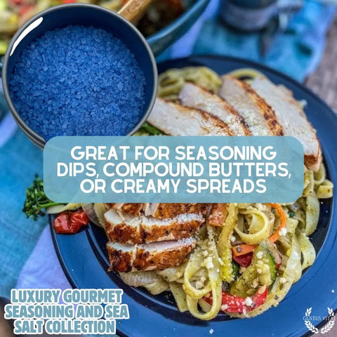 A bowl of blue sea salt is shown over pasta with grilled chicken and veggies. Gustus Vitae’s Gourmet Seasoning and Sea Salt Gift Set – 6 Tin Collection is perfect for dips, butters, or spreads. Handcrafted in the USA.
