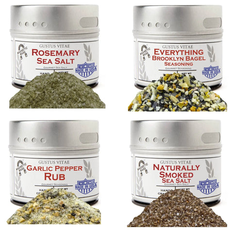 The Gustus Vitae Essential Summer Spices & Sea Salts Pantry Upgrade set includes four artisanal tins—Rosemary Sea Salt, Everything Brooklyn Bagel Seasoning, Garlic Pepper Rub, and Naturally Smoked Sea Salt.