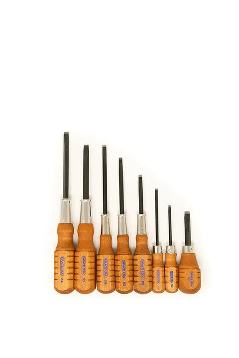 A set of seven flathead screwdrivers with wooden handles, arranged by size on a white background—perfect for any gunsmith kit and as part of the Grace USA Gun Care Tool Set in Nukaf Case by Grace USA.