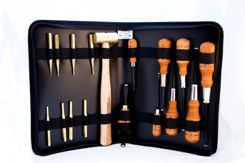 A black zippered Nukaf Case by Grace USA opens to reveal the Grace USA Gun Care Tool Set, including a mallet, chisels, punches, and screwdrivers with wooden handles—all securely held with elastic straps.