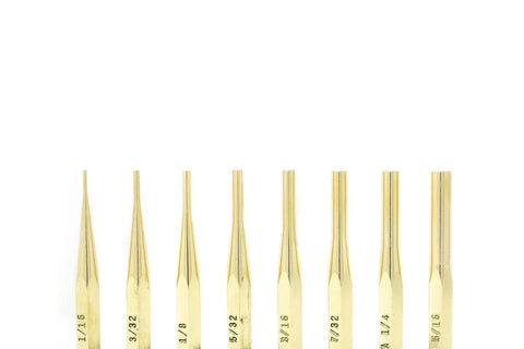 Eight American-made Grace USA Brass Pin Punch Set tools, each gold-colored and non-marring, are aligned vertically against a white background, with size labels near the base indicating varying tip sizes.