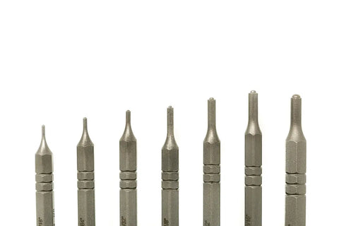 The Grace USA Steel Short Roll Pin Punch Set by Grace USA features seven precision-crafted metal punches of varying sizes, ideal for gunsmithing, displayed upright against a white background.