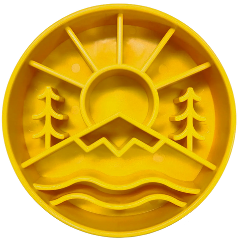 The SodaPup Great Outdoors Design eBowl is a yellow, round plastic slow feeder for dogs, with raised sections—sun, mountains, trees, water—that divide food areas and mimic outdoor scenery.